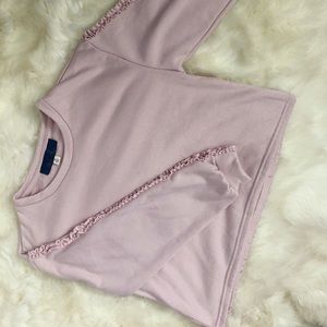 Sweater shirt with cute sleeve detailing.